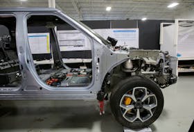 A partially dismantled Rivian R1T electric truck is seen during its teardown at the Munro & Associates headquarters in Auburn Hills, Michigan, U.S., June 3, 2022. 
