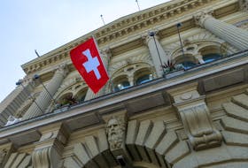The Swiss flag is seen on the Swiss Parliament house (Bundeshaus) in Bern, Switzerland, June 15, 2023. 