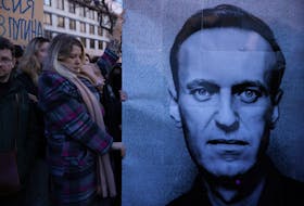 People gather outside the Russian embassy, following the death of Russian opposition leader Alexei Navalny, reported by prison authorities in Russia's Yamalo-Nenets region where he had been serving his sentence, in Warsaw, Poland, February 16, 2024. Dawid Zuchowicz/Agencja Wyborcza.pl via