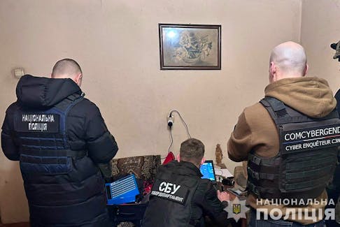 Cybersecurity specialists from Ukraine's Security Service work at an unknown location in Ukraine, in this undated handout released February 21, 2024. State Security Service of Ukraine/Handout via REUTERS