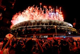 The Tokyo 2020 Olympics Opening Ceremony - Olympic Stadium, Tokyo, Japan - July 23, 2021. Fireworks are seen from outside the stadium during the Opening Ceremony.