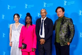 Cast members Ke-Xi Wu, Nina Melo and Han Chang pose with Director Abderrahmane Sissako as they attend a photocall to promote the movie 'Black Tea' at the 74th Berlinale International Film Festival in Berlin, Germany, February 21, 2024.