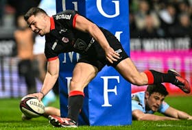 Toulouse French fly-half Antoine Dupont scores a try during the French Top 14 rugby union match between Stade Toulousain (Toulouse) and Aviron Bayonnais (Bayonne) at the Ernest-Wallon Stadium in Toulouse, south-western France, on Feb. 3.