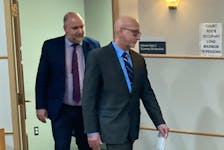 Peter Alan Moorhouse, right, enters Shubenacadie provincial court Thursday with lawyer Ian Hutchison for sentencing on two charges involving the sexual exploitation of children.  The judge accepted a joint recommendation from lawyers for a two-year prison sentence for Moorhouse, former president and CEO of the Better Business Bureau of Atlantic Canada.