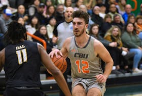 Mitchell Mersereau of Sydney River, right, was given the Atlantic University Sport men’s basketball student-athlete community service award for the 2023-24 season on Thursday. Mersereau is in his third season with the Cape Breton Capers. CONTRIBUTED/VAUGHAN MERCHANT, CBU ATHLETICS