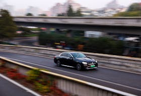 An electric vehicle (EV) by Mercedes-Benz moves on a street in Beijing, China October 31, 2023.
