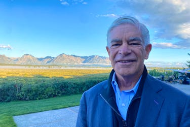 Federal Reserve Bank of Philadelphia President Patrick Harker stands behind the Jackson Lake Lodge in Jackson Hole, where the Kansas City Fed holds its annual economic symposium, in Wyoming, U.S. August 24, 2023.