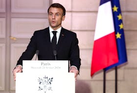 French President Emmanuel Macron speaks during a joint press conference with Armenian Prime Minister Nikol Pashinyan (not seen) as part of a meeting on the sidelines of the entry ceremony for Missak Manouchian and his resistance comrades into the Pantheon, at the Elysee Palace in Paris, France, February 21, 2024.