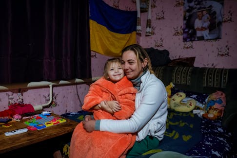 Alona Onyshchuk, 39, and her daughter Anhelina, 5, family of amkilled serviceman Serhii Aloshkin, play at home, amid Russia's attack on Ukraine, in the village of Lozuvatka, Dnipropetrovsk region, Ukraine, January 22, 2024.