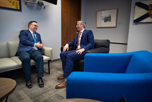 Nova Scotia Premier Tim Houston shares a laugh with new Community Services Minister Brendan Maguire (Halifax Atlantic) on Thursday, Feb. 22, 2024 in Halifax. Maguire crossed the floor from the Liberals to take up his new role. - Nova Scotia PCs