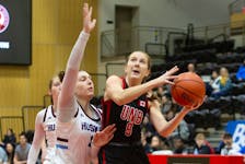 UNB Reds wing Jayda Veinot takes a shot over Saint Mary’s Huskies forward Marlo Steenbakkers during Atlantic University Sport women’s basketball action Jan. 13 in Fredericton, N.B.
James West/for UNB Athletics • Special to the Annapolis Valley Register