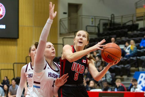 UNB Reds wing Jayda Veinot takes a shot over Saint Mary’s Huskies forward Marlo Steenbakkers during Atlantic University Sport women’s basketball action Jan. 13 in Fredericton, N.B.
James West/for UNB Athletics • Special to the Annapolis Valley Register
