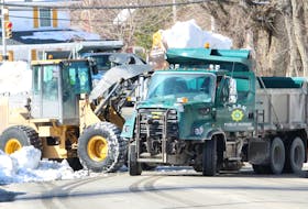 Snow being cleared along Cottage Road in Sydney gets dumped into a Cape Breton Regional Municipality public works truck on Wednesday. Thanks to two major snowstorms, CBRM's snow-clearing budget has been maxed out, according to a municipality spokesperson. IAN NATHANSON/CAPE BRETON POST