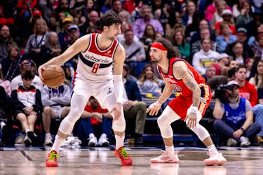 Feb 14, 2024; New Orleans, Louisiana, USA;  Washington Wizards forward Deni Avdija (8) dribbles against New Orleans Pelicans guard Jose Alvarado (15) during the second half at Smoothie King Center. Mandatory Credit: Stephen Lew-USA TODAY Sports