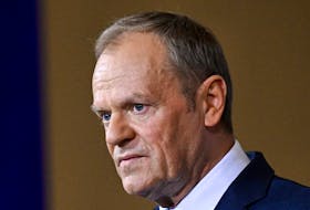 Polish Prime Minister Donald Tusk looks on at a press conference with German Chancellor Olaf Scholz (not pictured), at the Chancellery in Berlin, Germany February 12, 2024.
