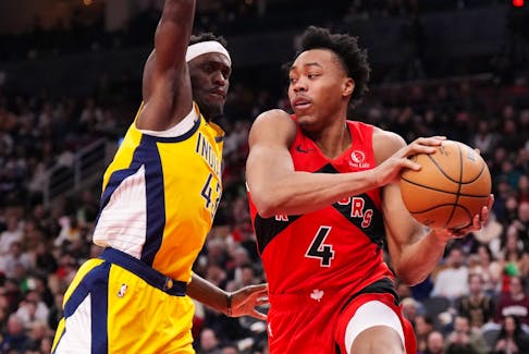 Toronto Raptors forward Scottie Barnes (4) drives past Indiana Pacers forward Pascal Siakam in a game before the all-star break. 
