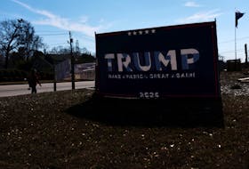 A sign supporting Republican presidential candidate and former U.S. President Donald Trump stands, ahead of the South Carolina Republican presidential primary election, outside the Greenville County Republican party headquarters, in Greenville, South Carolina, U.S., February 21, 2024.