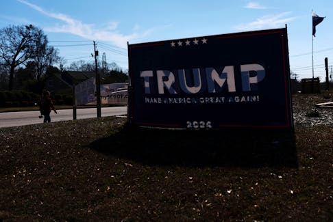 A sign supporting Republican presidential candidate and former U.S. President Donald Trump stands, ahead of the South Carolina Republican presidential primary election, outside the Greenville County Republican party headquarters, in Greenville, South Carolina, U.S., February 21, 2024.