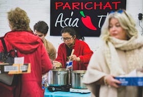 Parichat Lasingwong, co-owner of Parichat Thai Restaurant in Truro, scoops up a bowl of her tum yum soup during Soup Fest 2024, held on Feb. 13 at the Truro Farmer's Market. Parichat won first place in the voting contest for the second year in a row. Nick Gaines