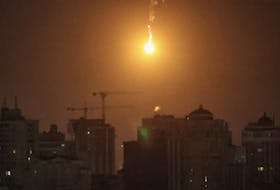 An explosion of a drone is seen in the sky over the city during a Russian drone strike, amid Russia's attack on Ukraine, in Kyiv, Ukraine November 25, 2023.