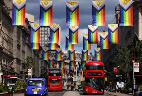 Intersex-Inclusive Pride flags, designed by Valentino Vecchietti and used to represent the LGBTIQ+ community, hang across Regent Street ahead of next weeks Pride parade in London, Britain, June 26, 2022.