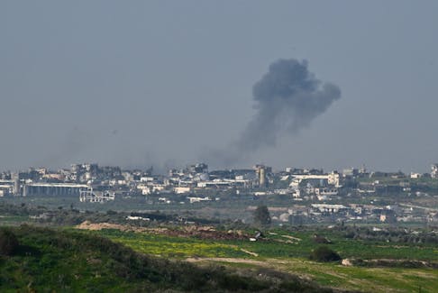 Smoke rises above Gaza, amid the ongoing conflict between Israel and the Palestinian Islamist group Hamas, as seen from Israel, February 13, 2024.