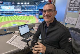 Former Toronto Blue Jays announcer Ben Wagner sits in the broadcast booth in 2022.