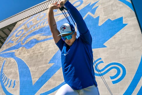 Toronto Blue Jays pitcher Ricky Tiedemann warms up during Spring Training.