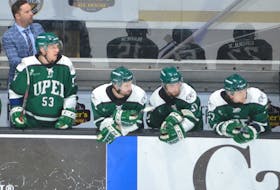 Kyle Dunn, standing left, watches the action on the ice as an assistant coach with the UPEI Panthers during the 2023 U Sports men’s hockey national championship tournament at Eastlink Centre in Charlottetown. Dunn, who now lives in Halifax, was recently named the coach of the year in the 2023-24 Nova Scotia Under-18 Major AAA Hockey League. Jason Simmonds • The Guardian