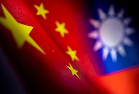 Chinese and Taiwanese printed flags are seen in this illustration taken, April 28, 2022. Picture taken April 28, 2022. 