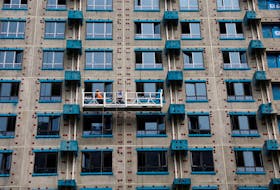 A person works at a residential building construction site in Beijing, China September 6, 2023.