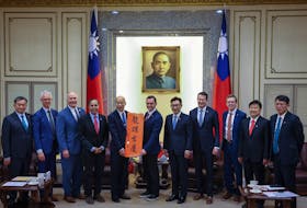 U.S. Representative Mike Gallagher, who chairs the House select committee on competition with China, poses for a group photo with Taiwan's Speaker and Deputy Speaker of the Parliament, Han Kuo-yu and Johnny Chiang, in Taipei, Taiwan, February 22, 2024.