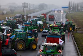 French farmers use their tractors during a protest over price pressures, taxes and green regulation, grievances shared by farmers across Europe, in Jossigny, near Paris, France, February 1, 2024.