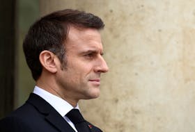 French President Emmanuel Macron waits for the arrival of a guest at the Elysee Palace in Paris, France, February 21, 2024.