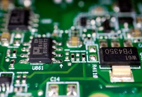 Semiconductor chips are seen on a printed circuit board in this illustration picture taken February 17, 2023.