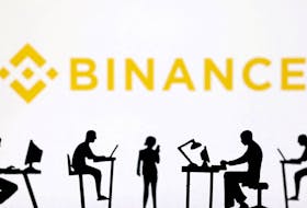 Figurines with computers and smartphones are seen in front of Binance logo in this illustration taken, February 19, 2024.