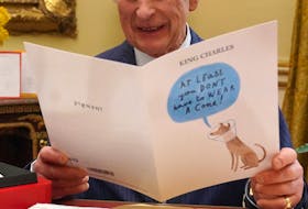 Britain's King Charles reads cards and messages, sent by well-wishers following his cancer diagnosis, in the 18th Century Room of the Belgian Suite in Buckingham Palace, London, Britain, February 21, 2024. Jonathan Brady/Pool via REUTERS
