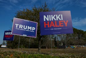 Campaign signs for Republican presidential candidates former U.S. Ambassador to the United Nations Nikki Haley and former U.S. President Donald Trump stand along an intersection in Mount Pleasant, South Carolina, U.S., February 22, 2024.