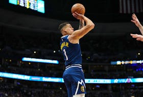 Feb 22, 2024; Denver, Colorado, USA; Denver Nuggets forward Michael Porter Jr. (1) lines up a three point shot in the first quarter against the Washington Wizards at Ball Arena. Mandatory Credit: Ron Chenoy-USA TODAY Sports/ File photo