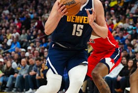 Feb 22, 2024; Denver, Colorado, USA; Denver Nuggets center Nikola Jokic (15) drives to the net in the second quarter against the Washington Wizards at Ball Arena. Mandatory Credit: Ron Chenoy-USA TODAY Sports