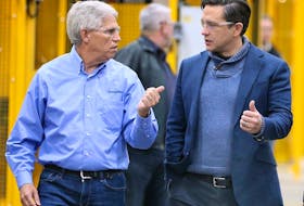  Michael Beneteau, left, CEO of CenterLine Limited in Windsor, speaks with federal Conservative Leader Pierre Poilievre during a tour of the facility on Friday.