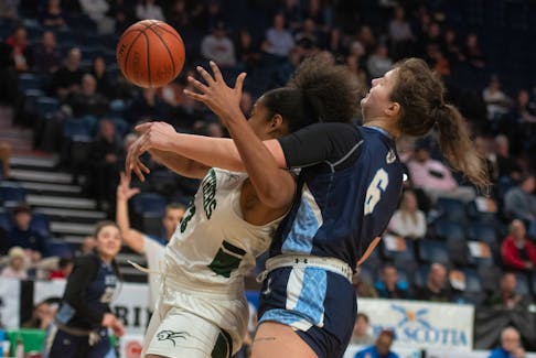 UPEI Panthers forward Aiden Rainford and St. F.X. X-Women forward Ekaterina Karchevskaya fight for rebound during an AUS Basketball Championships quarterfinal in Halifax on Friday, Feb. 23, 2024. St. F.X. won the game 80-55 and will play Saint Mary's in Saturday's semifinal.
Ryan Taplin - The Chronicle Herald