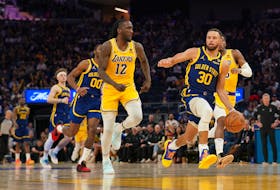 Feb 22, 2024; San Francisco, California, USA; Golden State Warriors guard Stephen Curry (30) dribbles past Los Angeles Lakers forward Taurean Prince (12) in the third quarter at the Chase Center. Mandatory Credit: Cary Edmondson-USA TODAY Sports