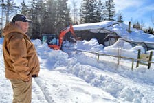 Two Rivers Wildlife Park manager John Huntington looks at the damaged cougar enclosure at the park. The home of Stumpy and Grumpy collapsed as a result of the Feb. 2-4 snowstorm. Huntington said replacing and repairing the enclosures damaged by the snow will cost more than $100,000. Chris Connors/Cape Breton Post