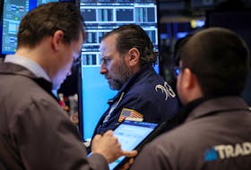 Traders work on the floor at the New York Stock Exchange (NYSE) in New York City, U.S., February 7, 2024. 