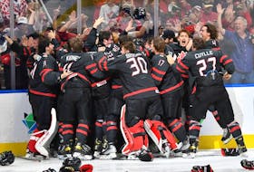Team Canada celebrates after defeating Finland to win the gold medal at the IIHF World Junior Championship at Rogers Place in Edmonton on Aug. 20, 2022.