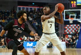 Dalhousie Tigers guard Nginyu Ngala is guarded by Shae Linton-Brown of the Saint Mary's Huskies during the AUS Final 6 basetball semifinal Saturday night at Scotiabank Centre. Ngala scored a career-high 37 points in the Tigers' 90-75 win. - Atlantic University Sport