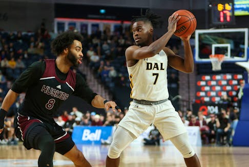 Dalhousie Tigers guard Nginyu Ngala is guarded by Shae Linton-Brown of the Saint Mary's Huskies during the AUS Final 6 basetball semifinal Saturday night at Scotiabank Centre. Ngala scored a career-high 37 points in the Tigers' 90-75 win. - Atlantic University Sport