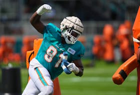 Aug 3, 2022; Miami Gardens, Florida, US; Miami Dolphins defensive end Emmanuel Ogbah (91) runs a drill during training camp at Baptist Health Training Complex. Mandatory Credit: Jasen Vinlove-USA TODAY Sports/File Photo