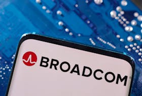 A smartphone with a displayed Broadcom logo is placed on a computer motherboard in this illustration taken March 6, 2023.